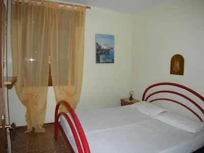 Letto o letti in una camera di Villa Milviana appartamento