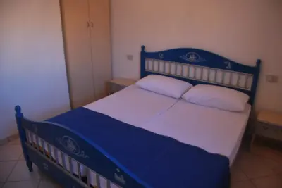 Letto o letti in una camera di Acquasmeralda appartamento 01