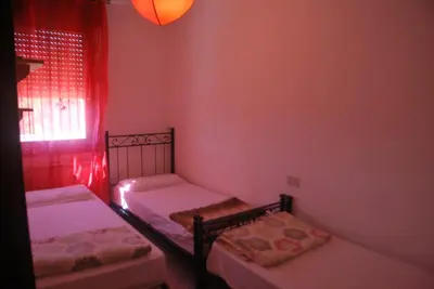 Letto o letti in una camera di Acquasmeralda appartamento 01