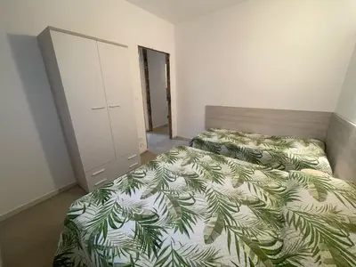 Letto o letti in una camera di Villa Gloria appartamento D03