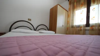 Letto o letti in una camera di Villa Gloria appartamento E01