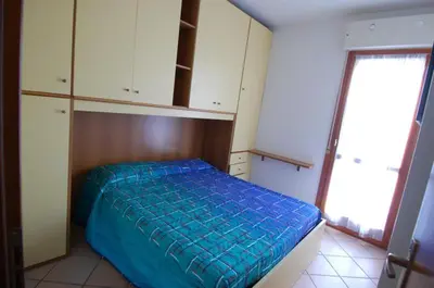 Letto o letti in una camera di Villaggio Tirreno appartamento 01