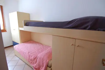 Letto o letti in una camera di Villaggio Tirreno appartamento 01