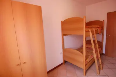 Letto o letti in una camera di Villaggio Tirreno appartamento 01
