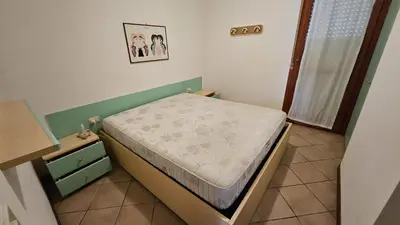 Letto o letti in una camera di Villaggio Tirreno appartamento 02
