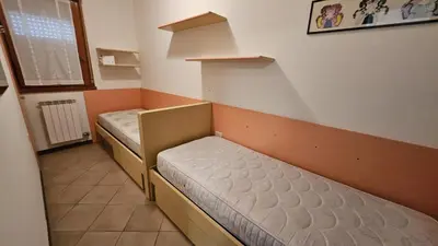 Letto o letti in una camera di Villaggio Tirreno appartamento 02