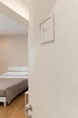 Letto o letti in una camera di Maison Altinia, locazione in centro storico a due passi dalla stazione