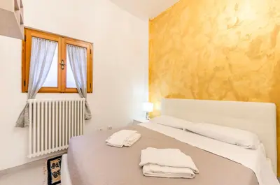 Letto o letti in una camera di ANDREA Venice FLAT Mezzanine Floor