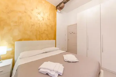 Letto o letti in una camera di ANDREA Venice FLAT Mezzanine Floor