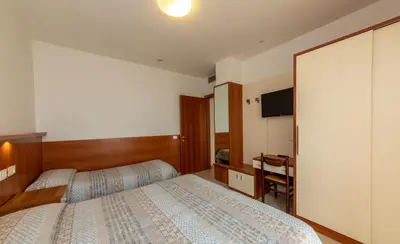 Letto o letti in una camera di Residence Alla Rotonda