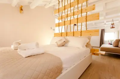 Letto o letti in una camera di Colibrì House ApartSuite Chioggia