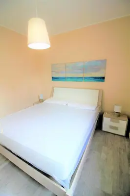 Letto o letti in una camera di Villa Marianna