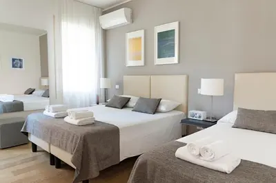 Letto o letti in una camera di B&B Villa Rosa