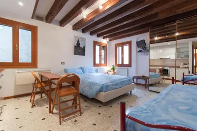 Letto o letti in una camera di Appartamenti Cà d'Oro