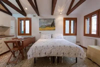 Letto o letti in una camera di Appartamenti Cà d'Oro