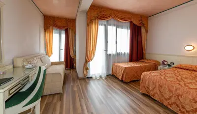 Letto o letti in una camera di Hotel Carlton