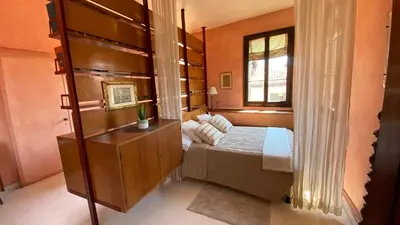 Letto o letti in una camera di CA' ROMANTICA - BIG APPARTMENT at ACCADEMIA