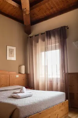 Letto o letti in una camera di Locanda Montegrappa