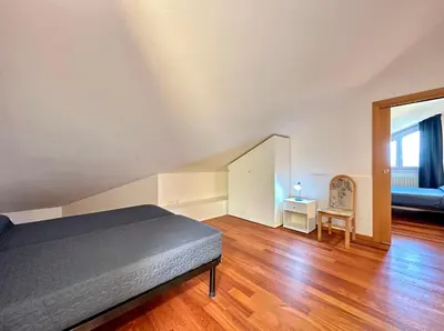Letto o letti in una camera di Villa Daniela con piscina - Carraro Immobiliare - Family Apartments
