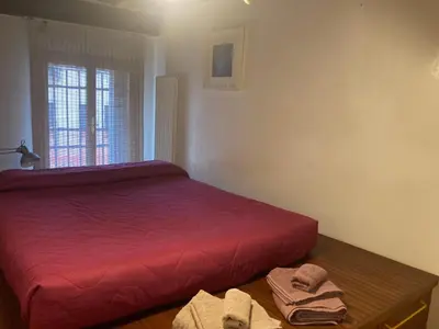 Letto o letti in una camera di Bellissimo appartamento in Palazzo Storico