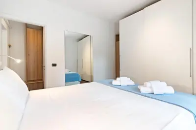 Letto o letti in una camera di GuestHost - A pochi passi da Prato della Valle Apartment