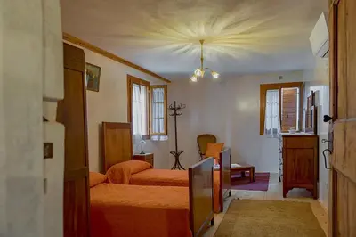 Letto o letti in una camera di Casa Dal Zotto