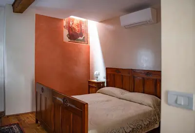 Letto o letti in una camera di Casa Dal Zotto