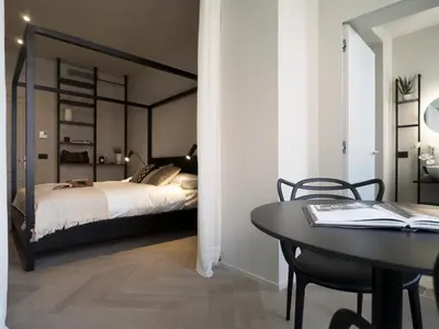 Letto o letti in una camera di Dimora Arco di Mezzo