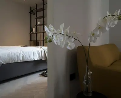 Letto o letti in una camera di Dimora Arco di Mezzo