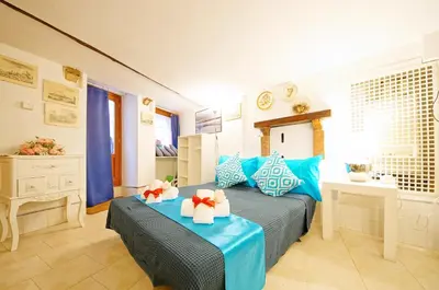 Letto o letti in una camera di Corte Rota Terrace San Marco