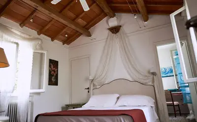 Letto o letti in una camera di Cà del Mar rustico a Jesolo con giardino e piscina privati ad uso esclusivo #