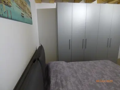 Letto o letti in una camera di CASA MODERNA A DUE PASSI DA RIALTO