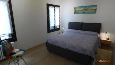 Letto o letti in una camera di CASA MODERNA A DUE PASSI DA RIALTO