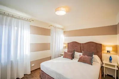 Letto o letti in una camera di Lo Squero 3 Apartment with Balcony in Dorsoduro