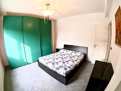 Letto o letti in una camera di Terrazza Piramide- Carraro Immobiliare - Family Apartments