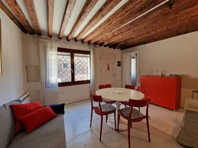 Area soggiorno di Veneziacentopercento Ca' Riello Apartment