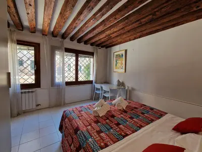 Letto o letti in una camera di Veneziacentopercento Ca' Riello Apartment