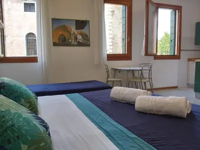 Letto o letti in una camera di Veneziacentopercento Corderie Apartment