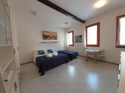 Letto o letti in una camera di Veneziacentopercento Corderie Apartment