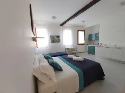Letto o letti in una camera di Veneziacentopercento Corderie Apartment