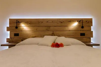 Letto o letti in una camera di Veneziacentopercento Arco Apartment