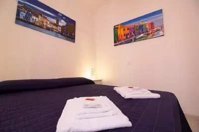 Letto o letti in una camera di Veneziacentopercento San Pietro Apartment