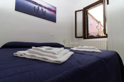 Letto o letti in una camera di Veneziacentopercento San Pietro Apartment