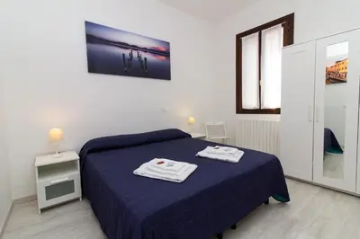 Letto o letti in una camera di Veneziacentopercento San Pietro Apartment