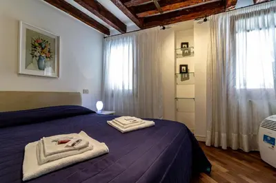 Letto o letti in una camera di Veneziacentopercento Gorne Apartment