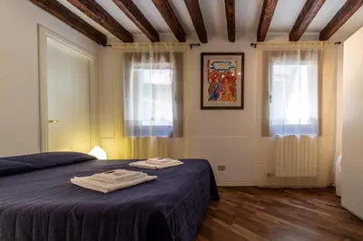 Letto o letti in una camera di Veneziacentopercento Gorne Apartment