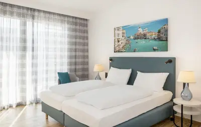 Letto o letti in una camera di Hapimag Apartments Cavallino