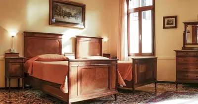 Letto o letti in una camera di B&B Corte Campana