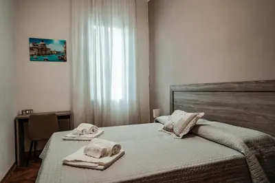 Letto o letti in una camera di Angelica Home