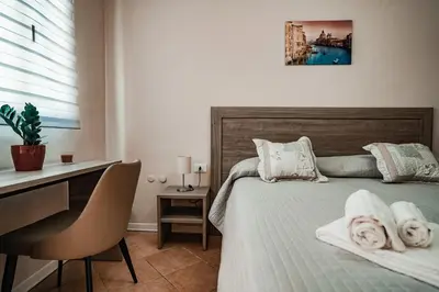 Letto o letti in una camera di Angelica Home